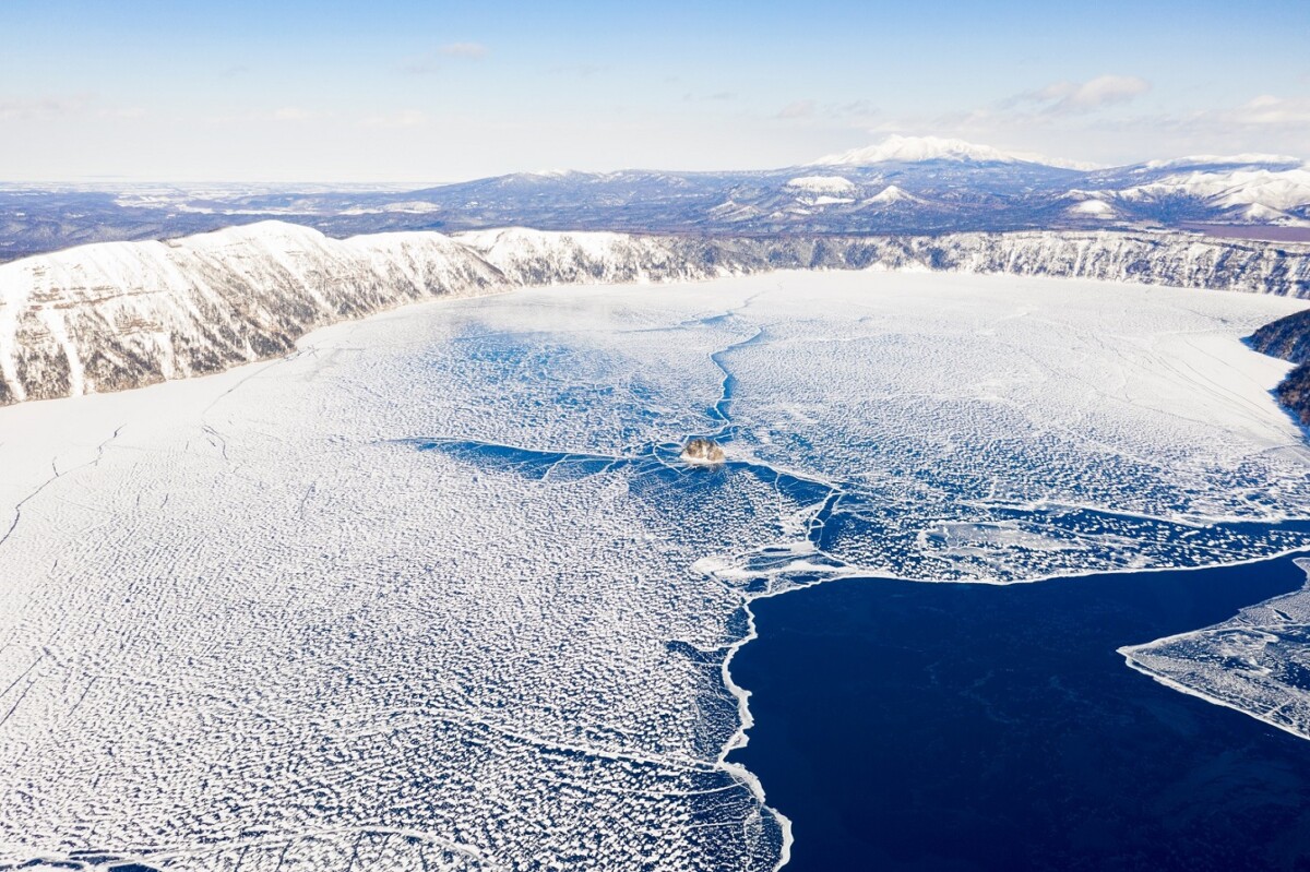 Aerial,view,of,the,frozen,lake,mashu,(has,volcano,crater)during